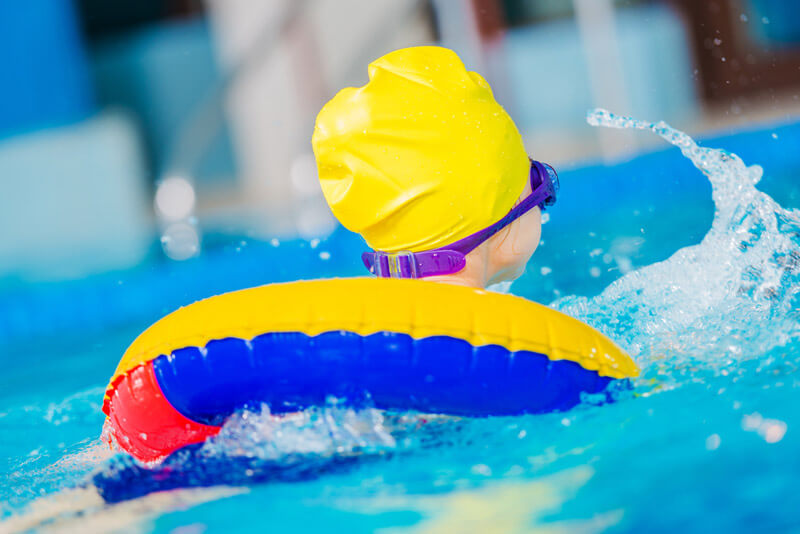 Child with Swimming Toys 